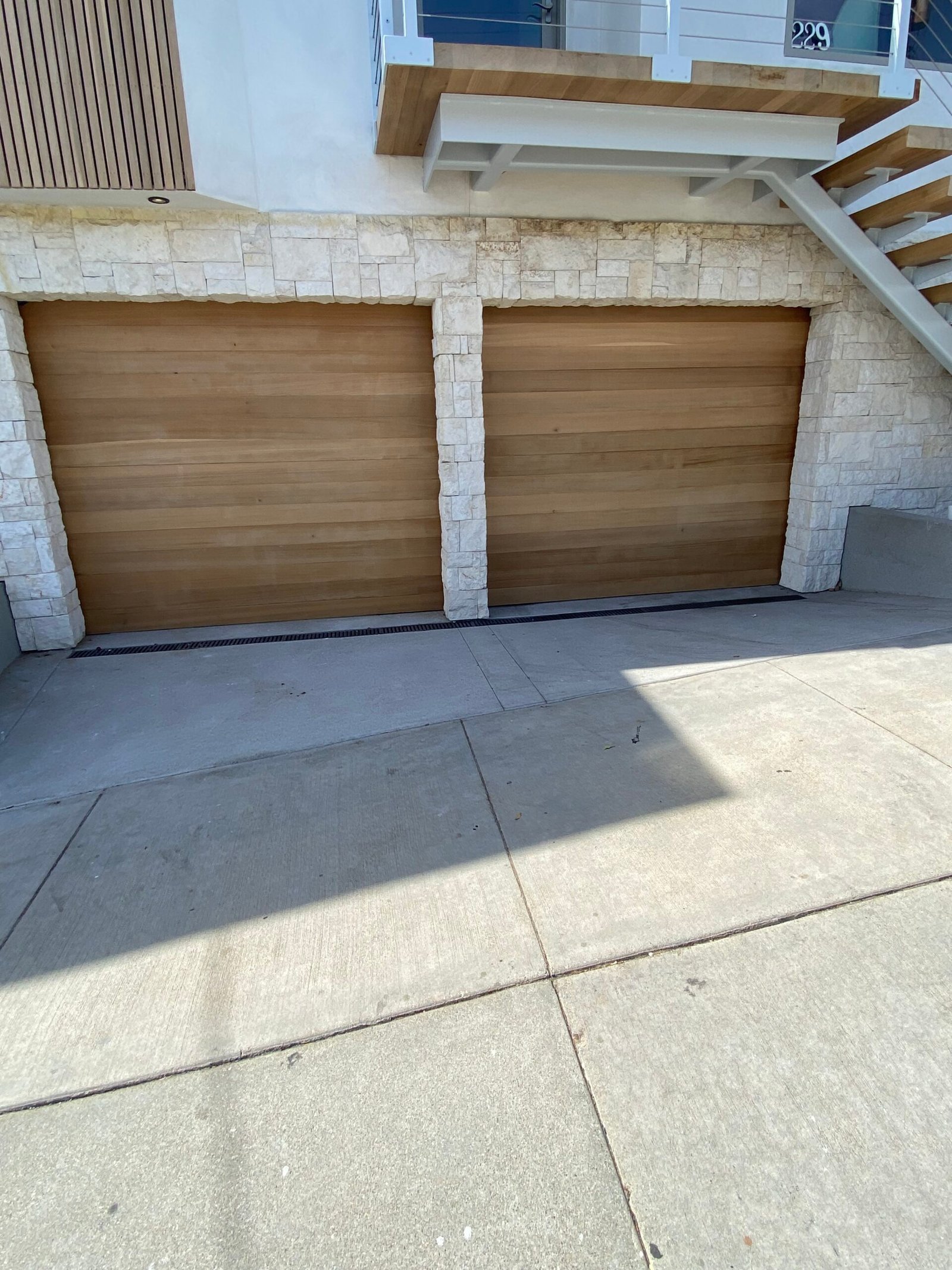 Maintenance service for two single-car garage doors in Whittier, California